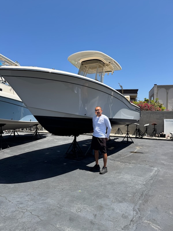 Jonathan, owner of Best In Class Detailing, with a client's boat